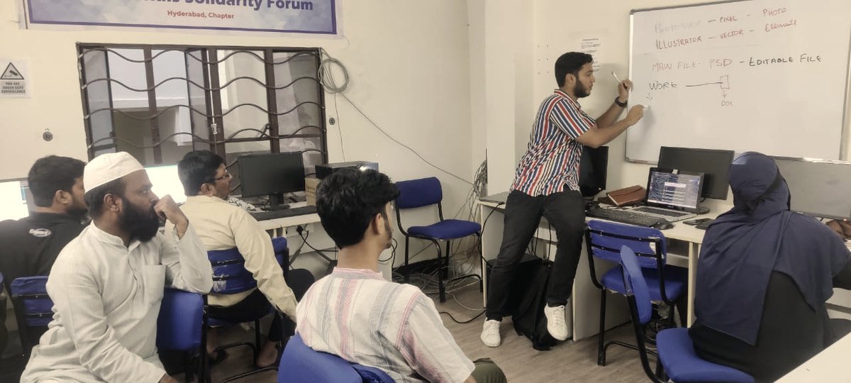 Teaching a graphic design class at the whiteboard
