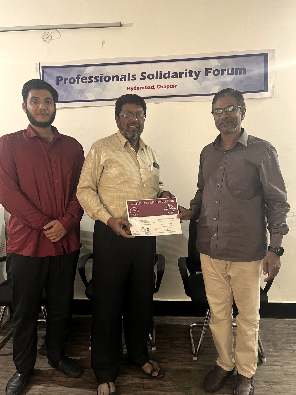 A student aged sixty-plus receiving his certificate